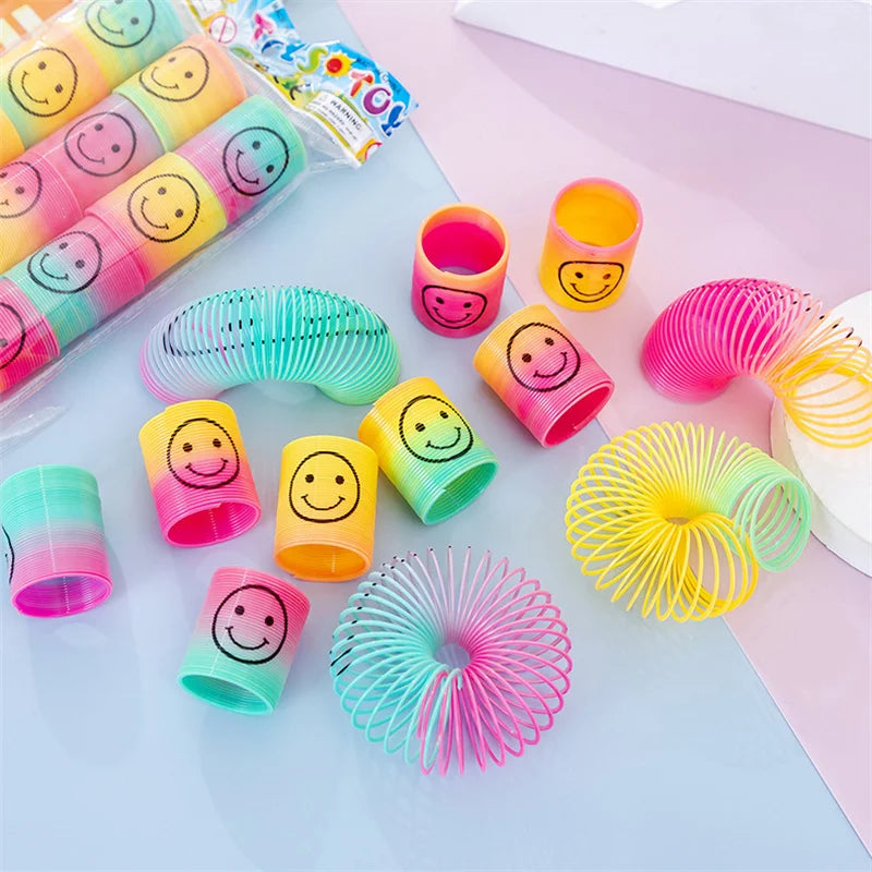 🔵 12Pcs Mini Smiley Face Rainbow Neon Magic Spring Toys - Cyprus